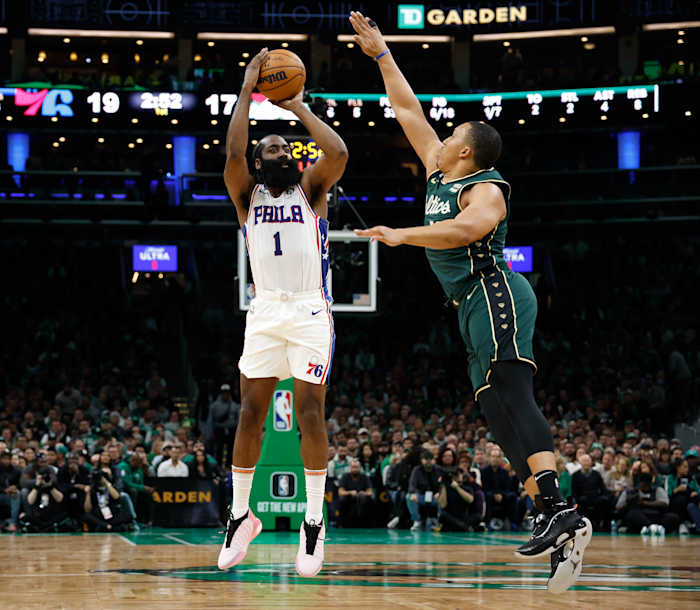 76ers guard James Harden shoots over Celtics forward Grant Williams.